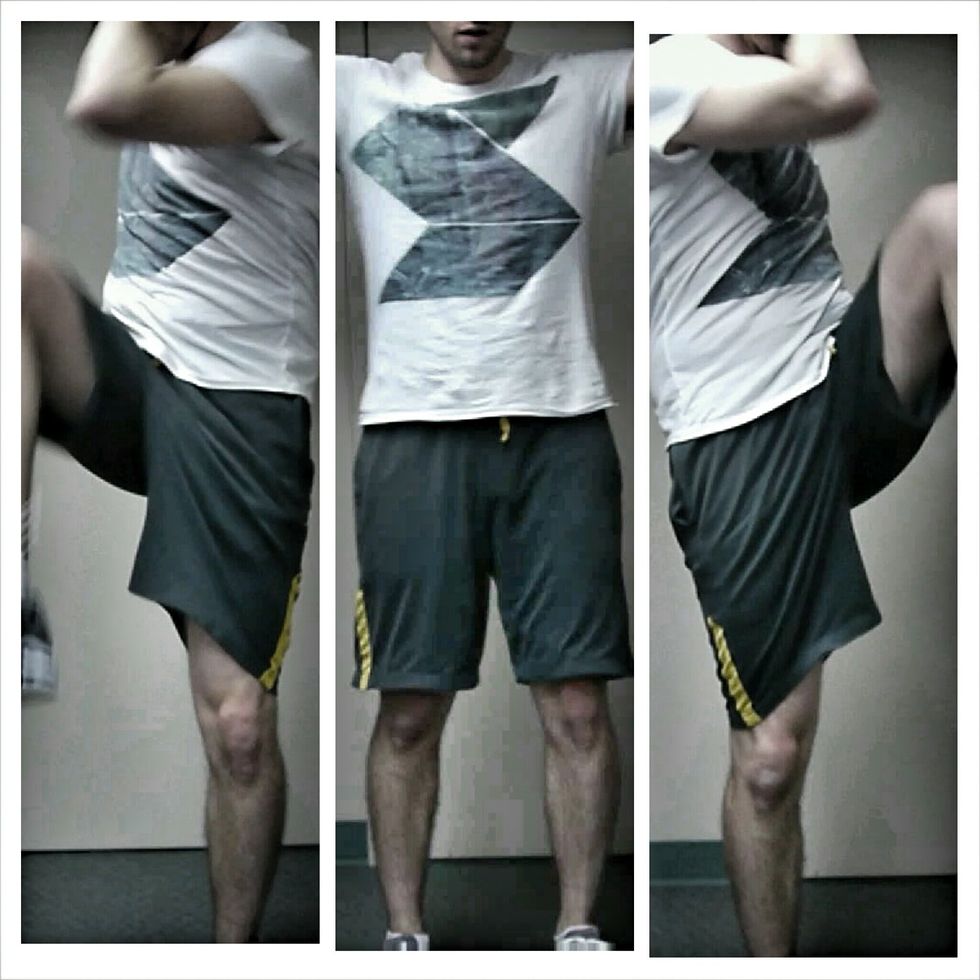 Put your fingertips against your temples, and twist your body without bending over, bringing the opposite knee up to touch the opposite elbow Raise the knee rather than lowering the elbow. Core tight.