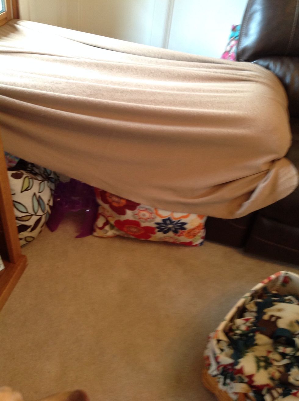 Put your first blanket up. It should go over the entrance. If you don't have a window or a couch to tuck the blanket in, this is where your duck tape comes in. Just patch it on the wall.