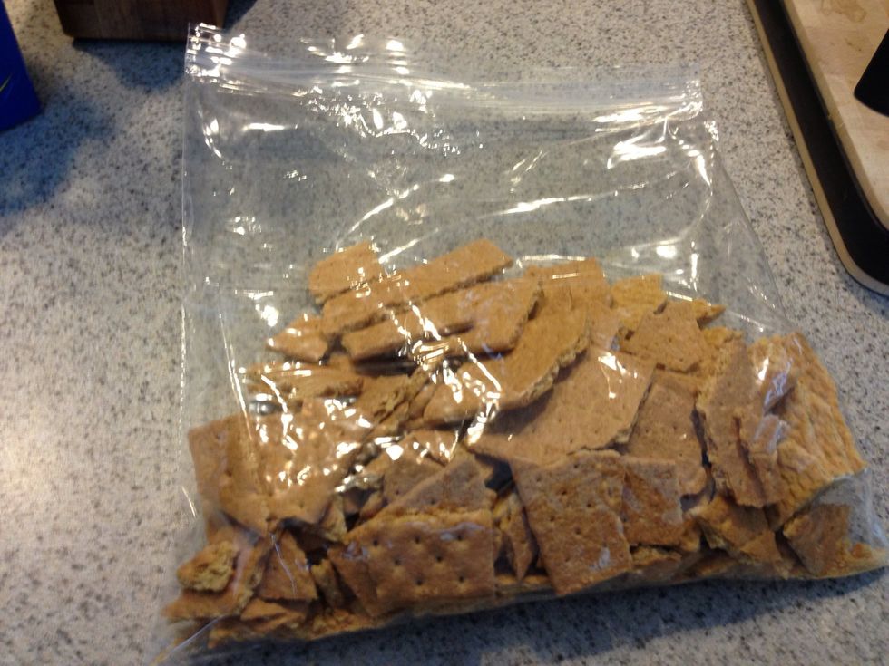 Put your graham crackers in a zip lock bag. The more crackers you use the thicker your crust will be. I use 1 pack of gram crackers.