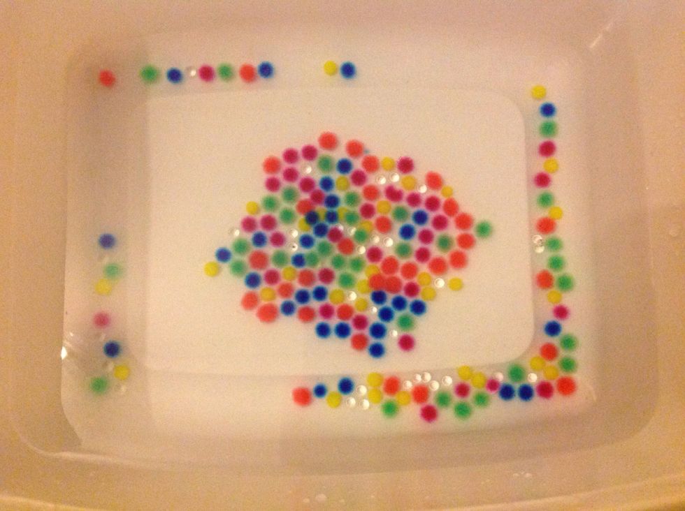 Put your growing gel beads in a bowl of water for the time instructed on the packet. (Mine was 2 hours). Add a few drops of fragrance oil to the water and leave your beads to grow.