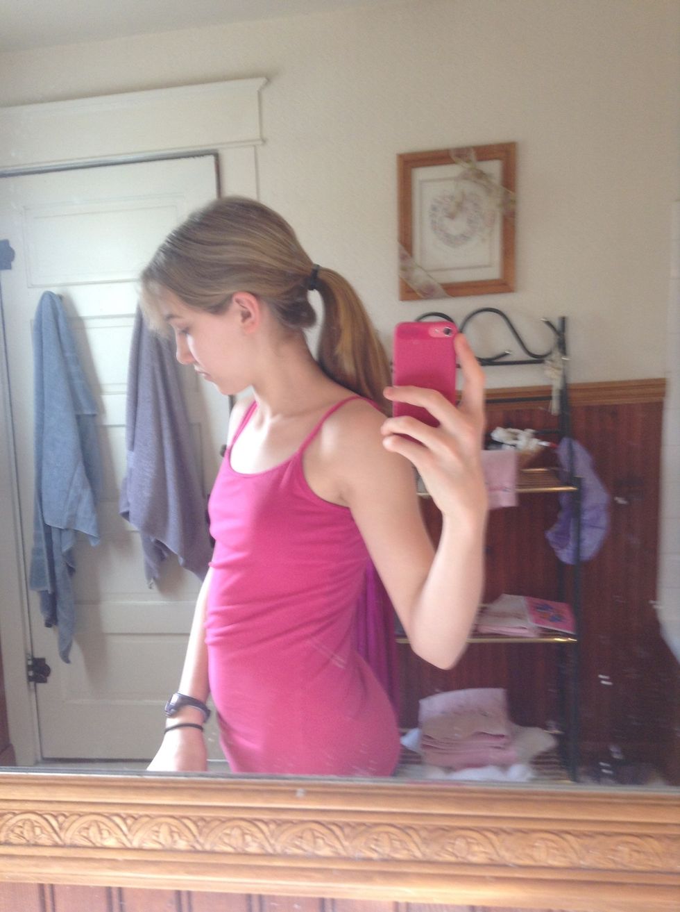 Put your hair in a ponytail. It can be as low or high as you want. I just go medium.