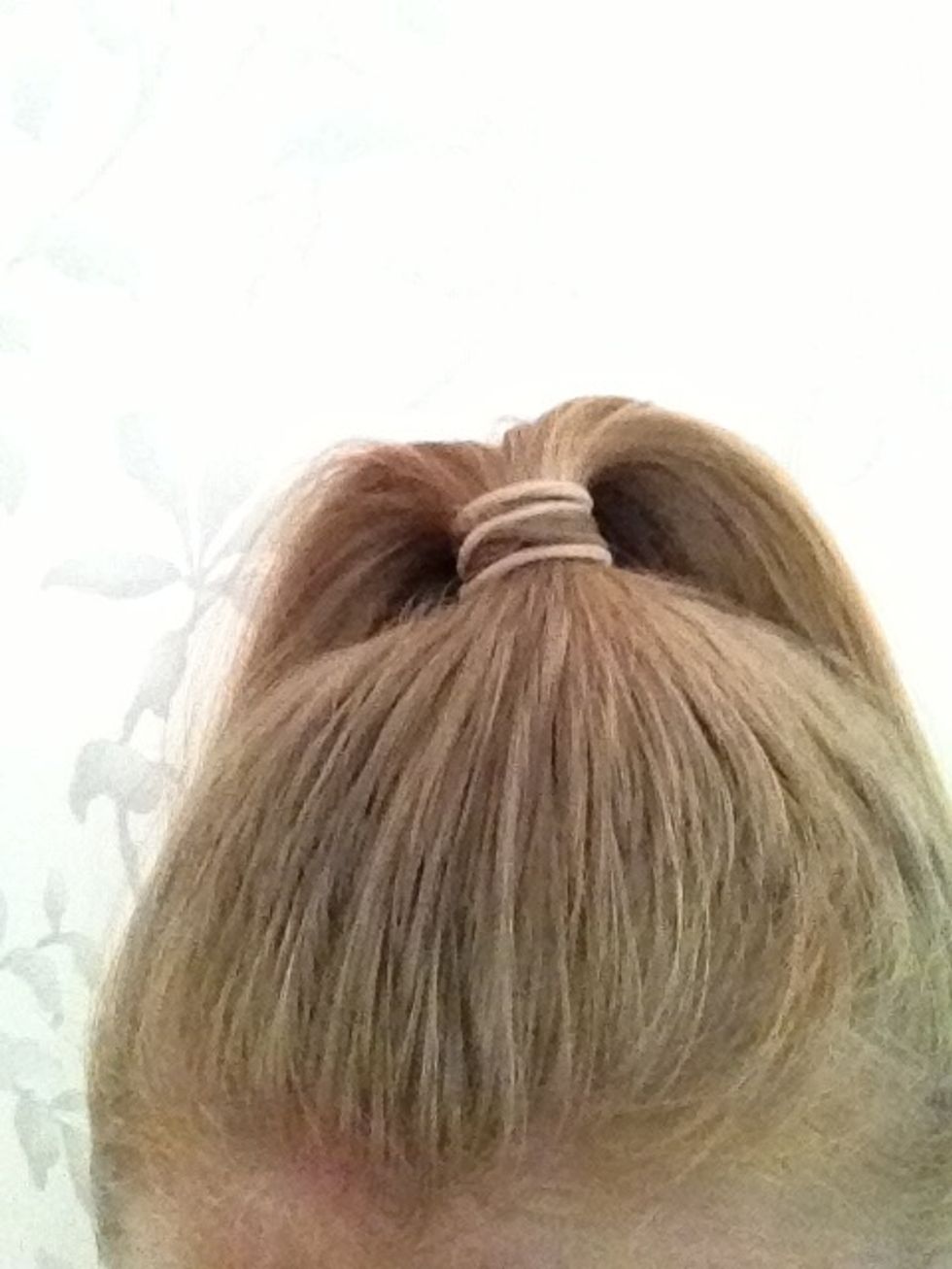 Put your hair in a really high pony tail so it is on top of your head