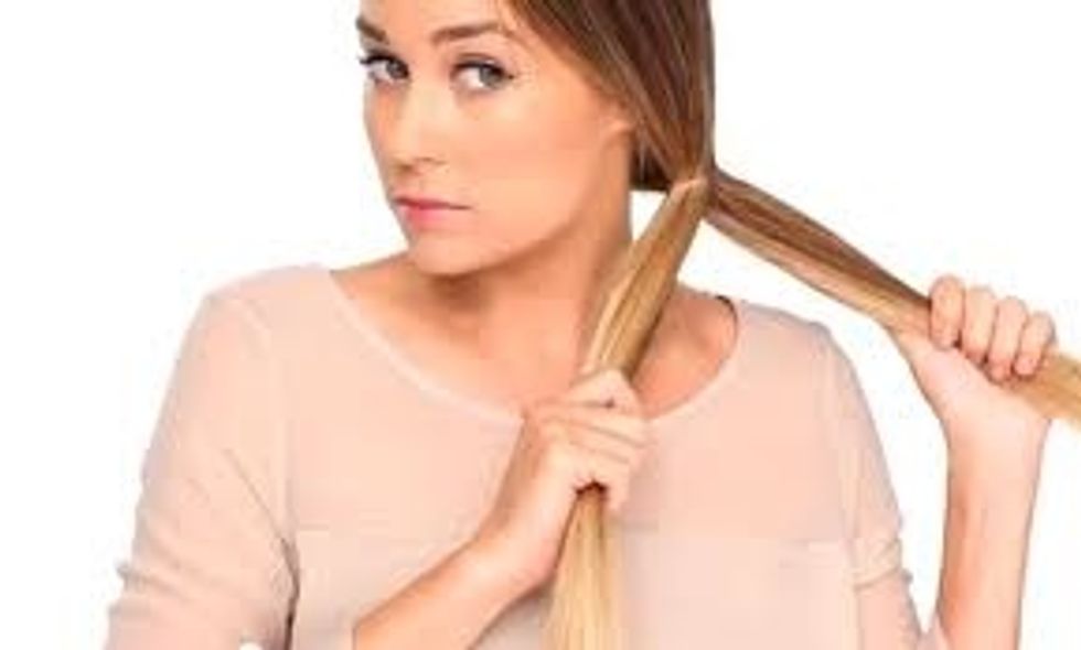 put your hair in a side pony tale then spit your hair into two pieces