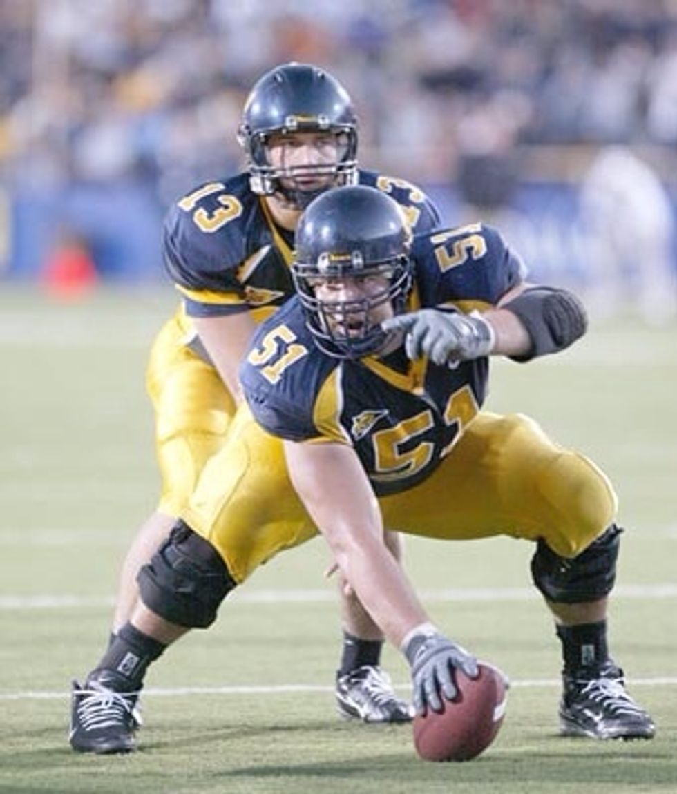 Put your hand on the ball and bend down so it looks like you squatting.