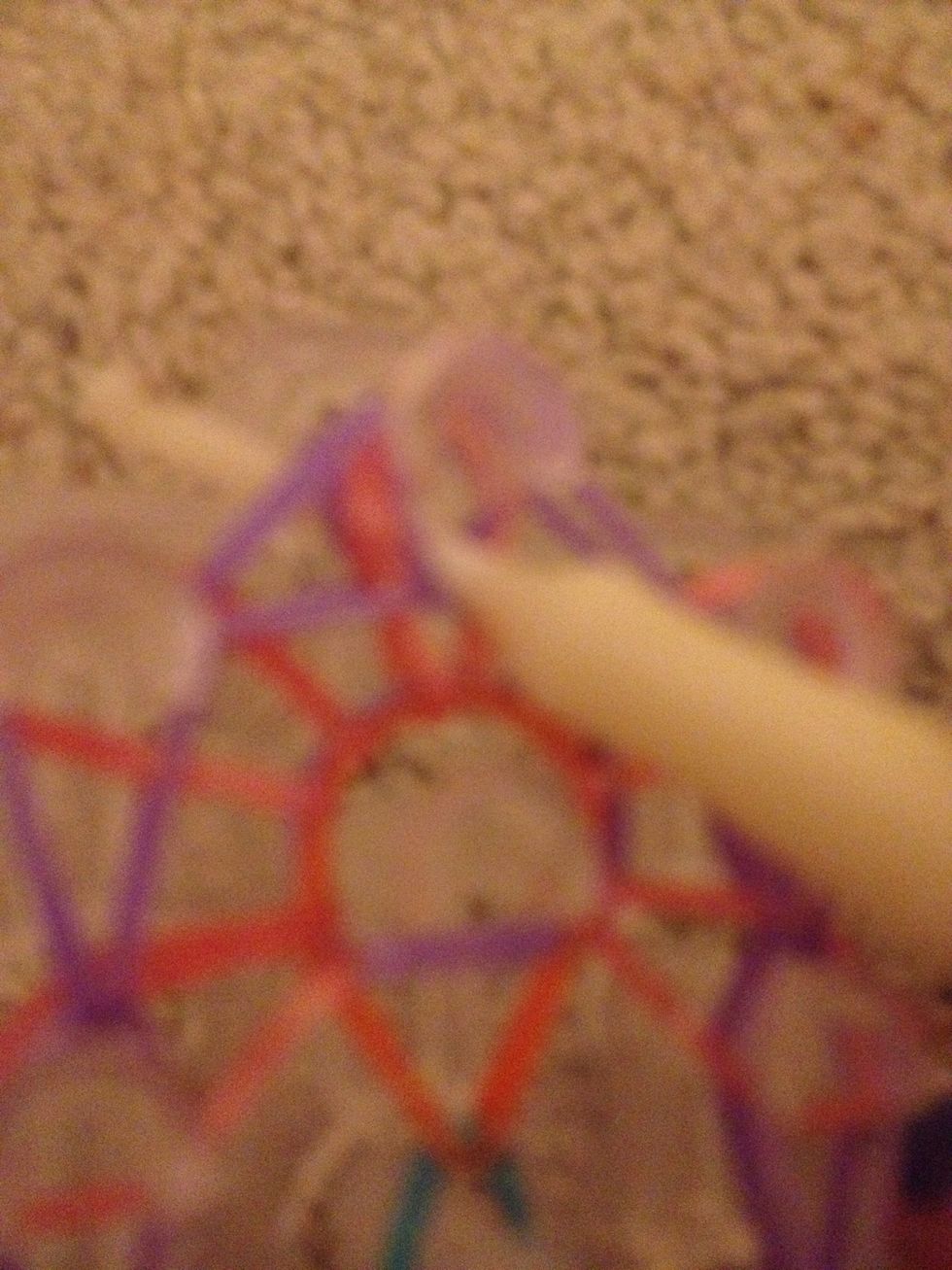 Put your hook through the middle of the bands at the top