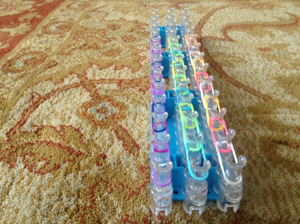 Put your loom facing upwards and put 9 rubber bands all the upwards. But don't do at this moment first i'll show you how to do it!!!!!!