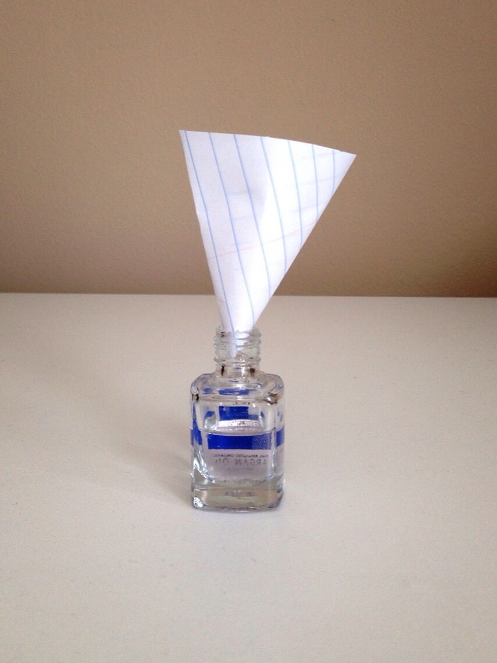 Put your mask on, & using a funnel (I made one with a piece of paper and tape) pour in one teaspoon of the powder. Be careful as the powder is very fine and can be inhaled. Wipe up any excess powder.