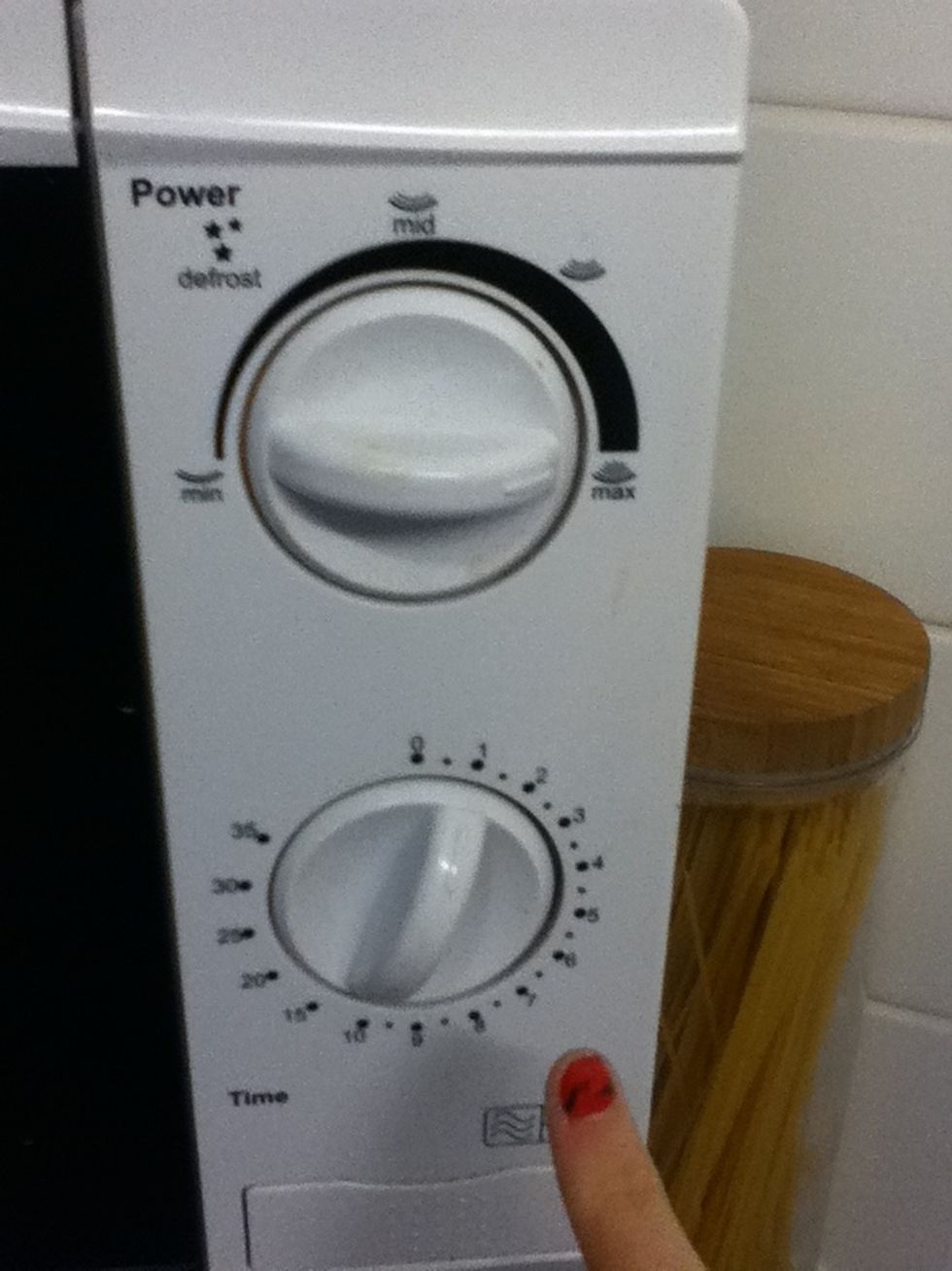 Put your microwave on full heat for one minute to melt the lip balm. Keep checking on it!