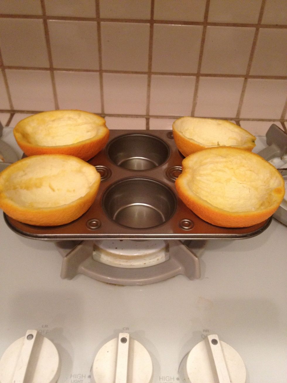 Put your oranges in the muffin tin so they sit upright.