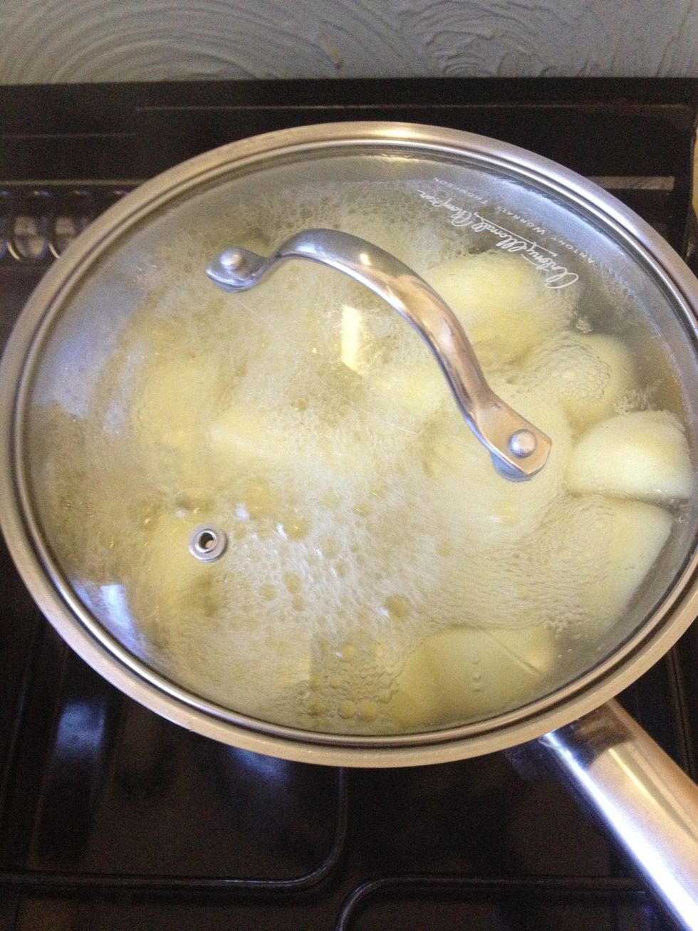 Put your oven on at full and get a high sided baking tray, boil your potatoes until they are easy to break up with a fork and basically cooked