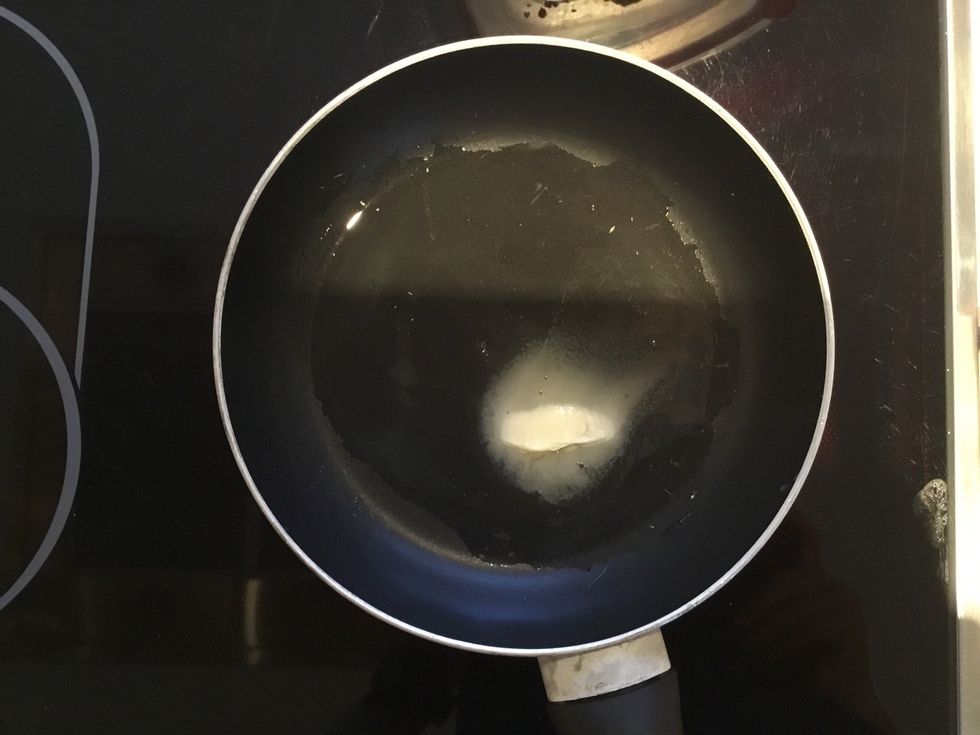 Put your pan onto the stove and then the butter into the pan So that the butter goes all over