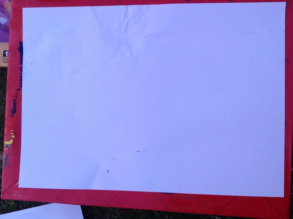 Put your paper on top of the material you are using to protect you table or desktop