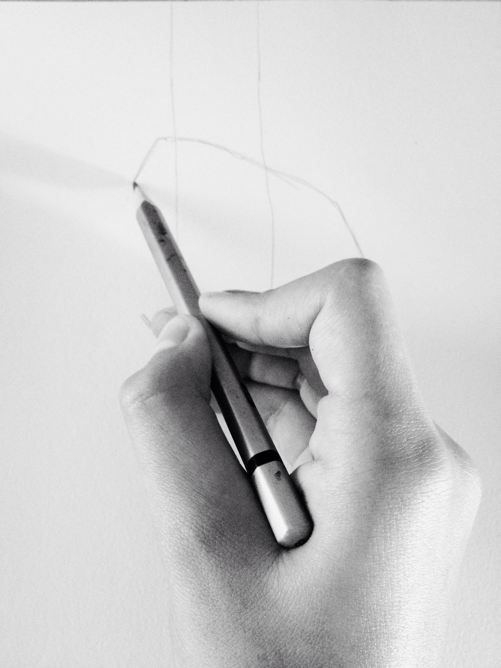 Put your pencil on the pointer-finger outline.