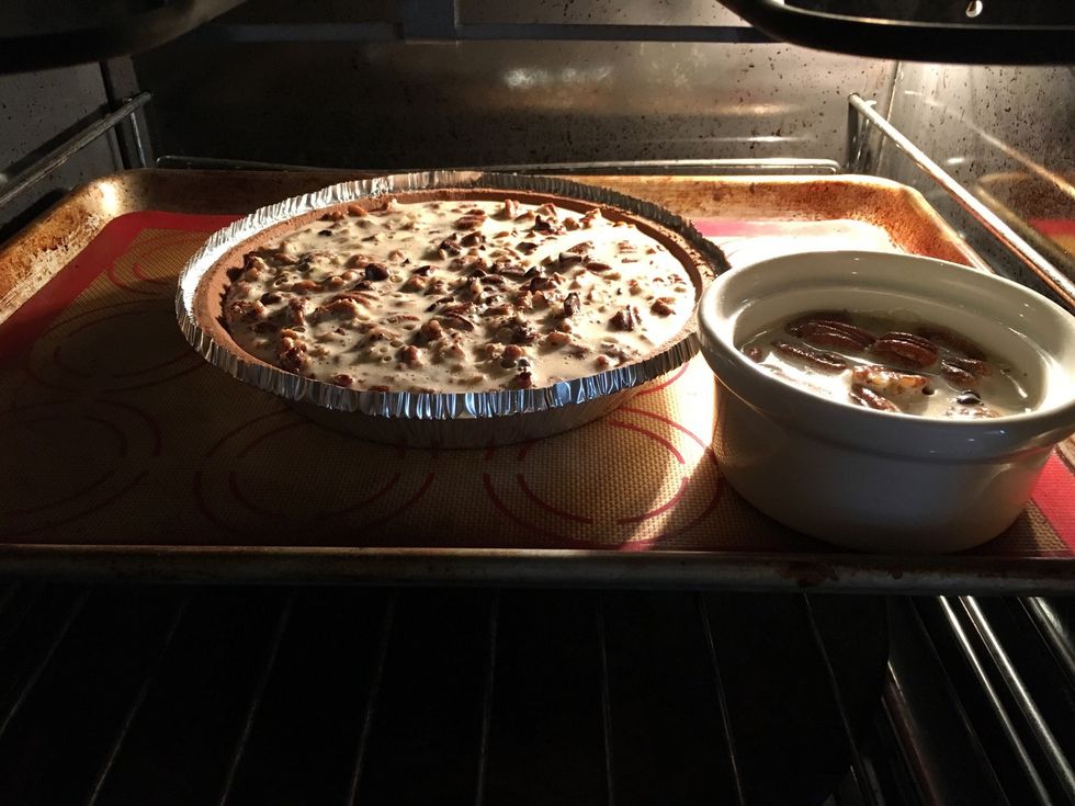 Put your pie (and ramekin) on a sheet pan and into the 300 degree preheated oven. 50-60 minutes. Remember, three hundred. No higher.