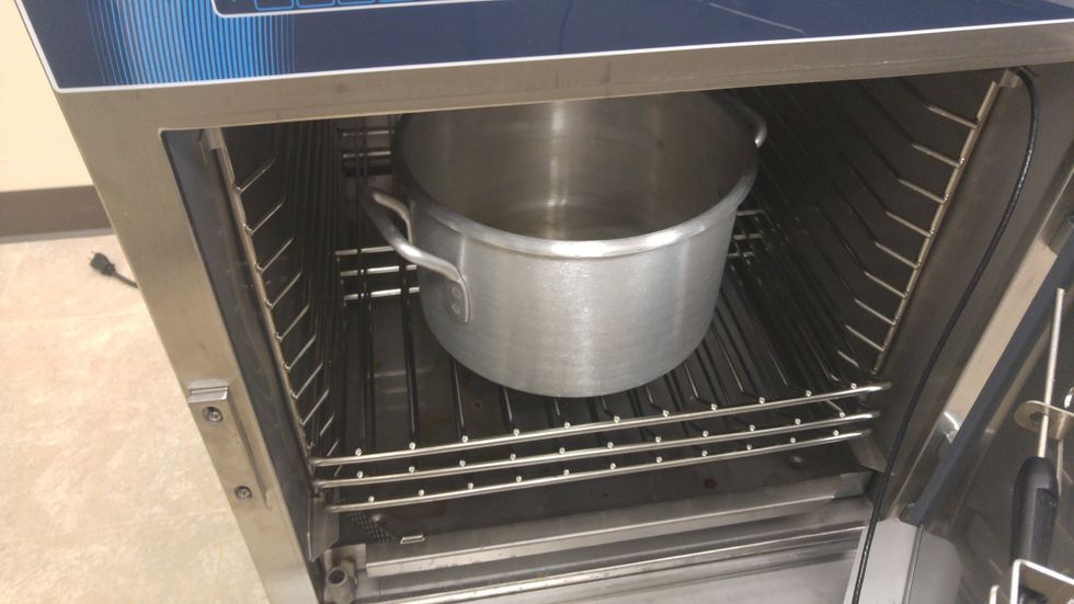 Put your pot inside the oven to preheat.  Also put your stock in a separate pan in to heat up as well.