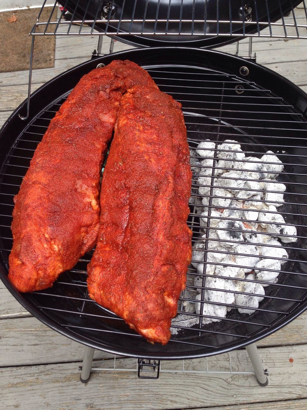 Put your ribs on the half of the grill opposite the coals. Now, close the grill, walk away, and don't come back for an hour and a half. Seriously. Leave. And don't come back. For 90 minutes.