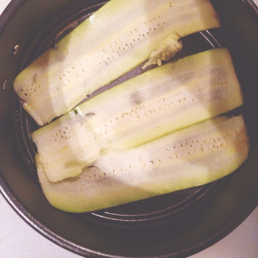 Put zucchini in the tin first