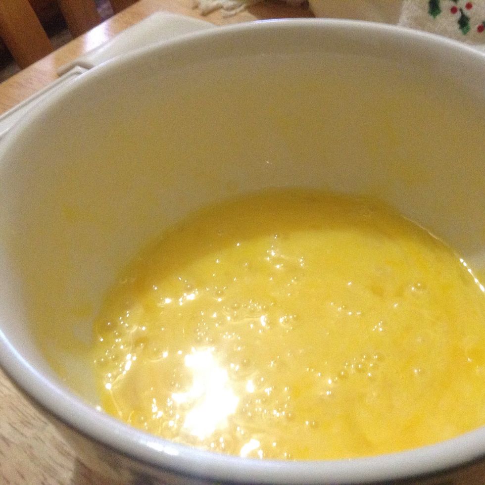 Puts eggs in bowl with everything