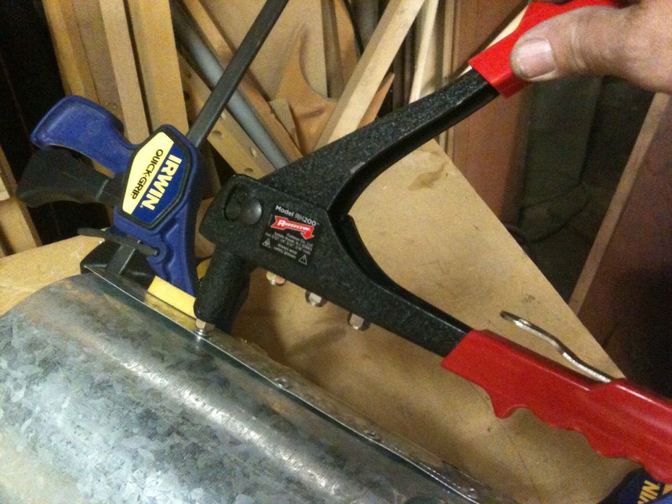 Putting in the rivets.