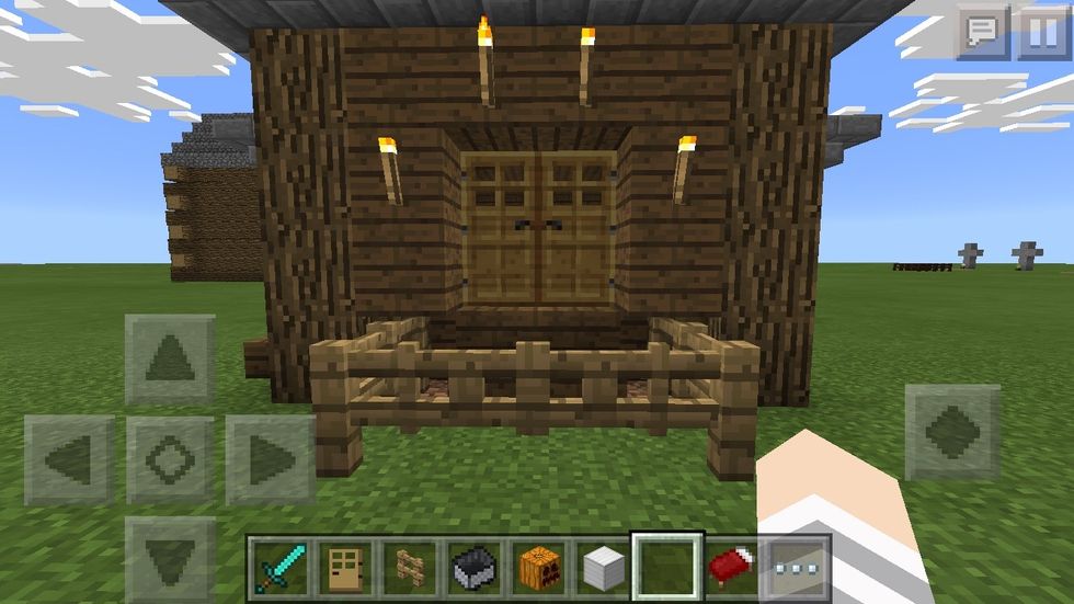 Putting torches around your door looks fancy!