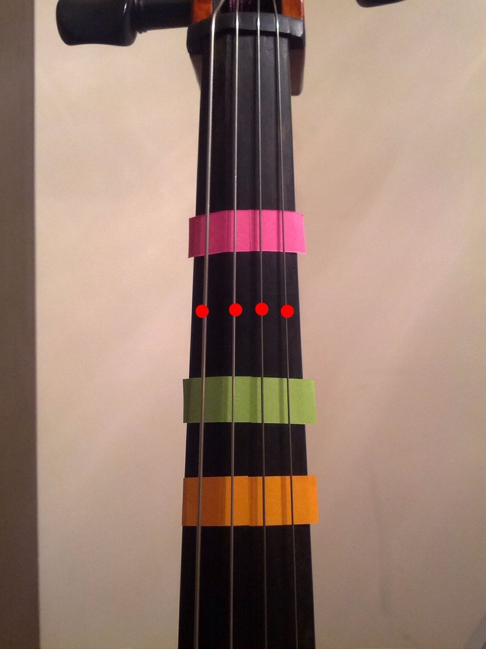 Putting your first finger on the red dots would be 2nd position. Learning it can be slightly confusing. Especially when you extend your fingers. (A completely different lesson right there). :)