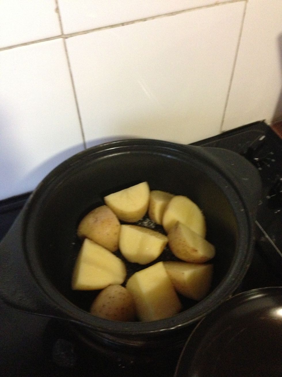 Quarter the potatoes and place in a pot with salt