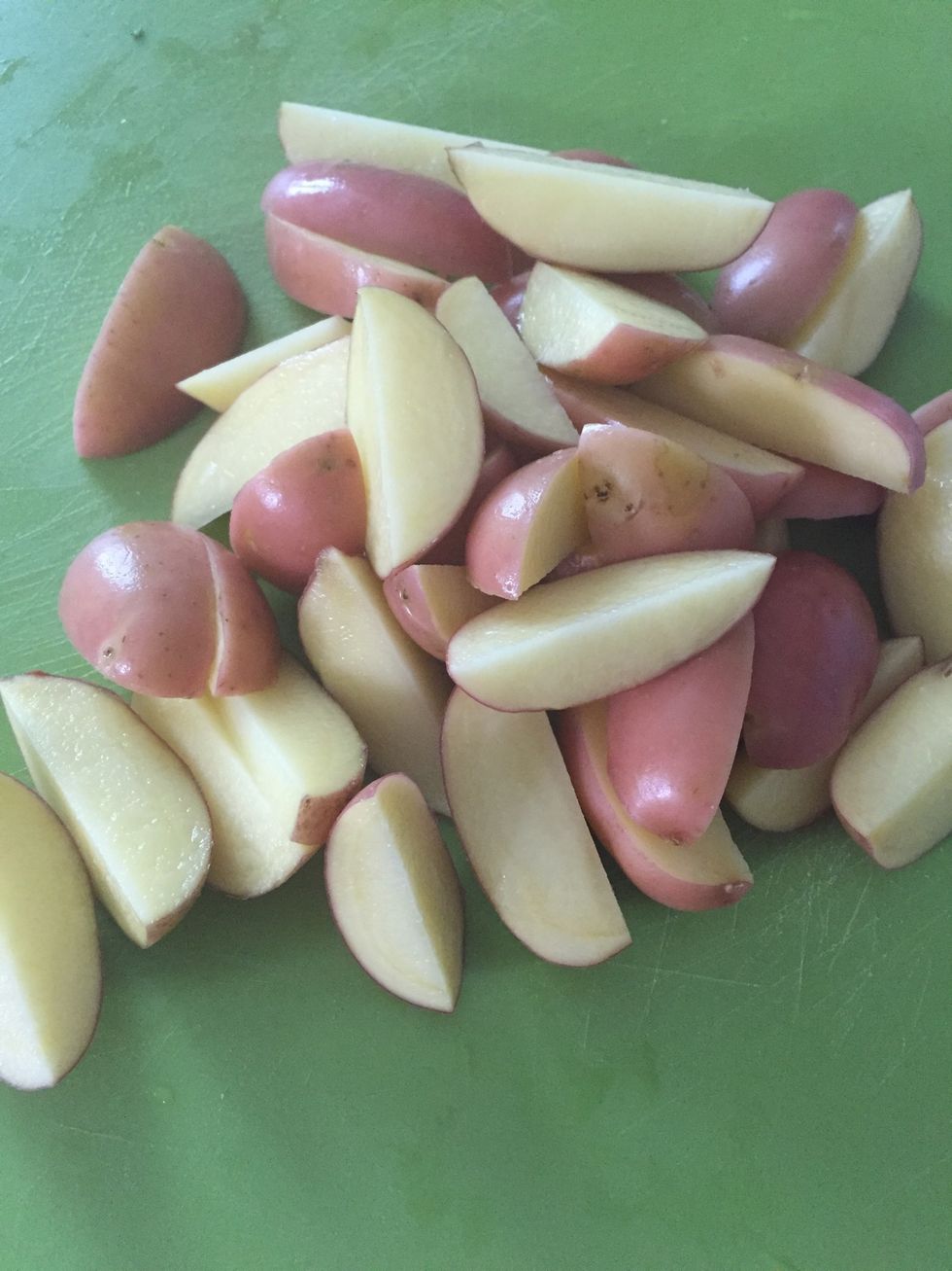 Quarter the potatoes.