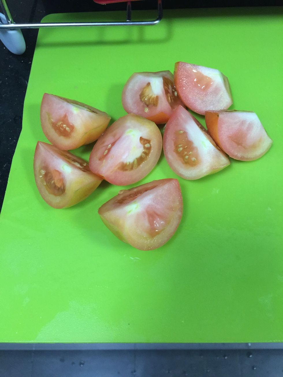 Quarter the tomatoes