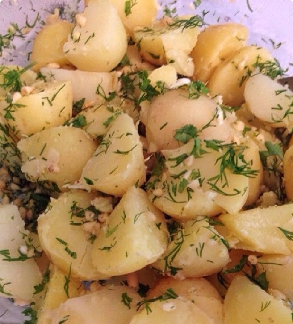 ...quarter them and add them to the bowl. Pour in the olive oil.