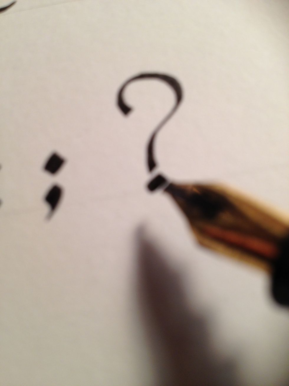 Question marks are thinner and less curvy than their modern counterparts; also, note the reduced distance between the dot and the body. They should almost touch.