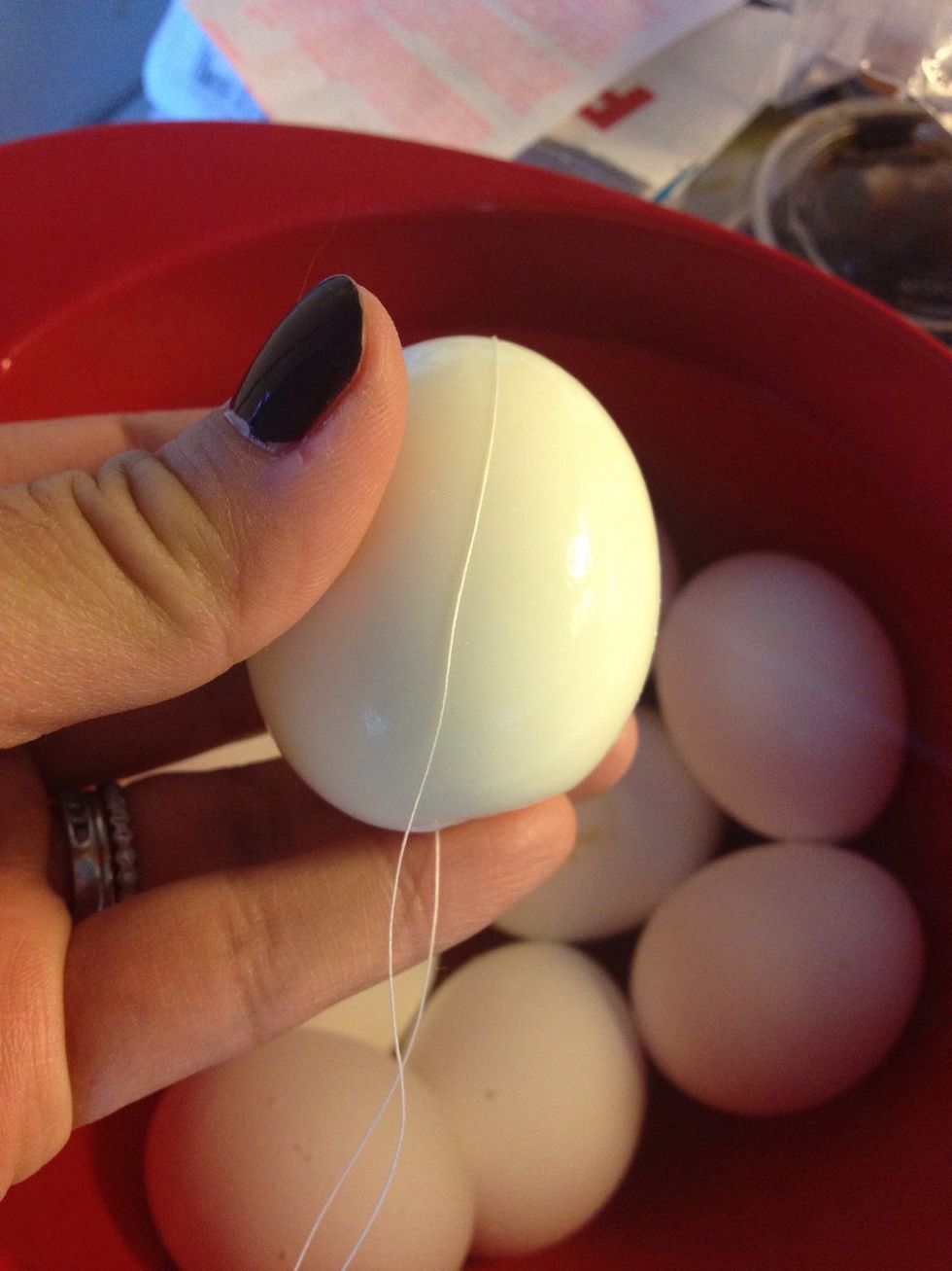 Quick tip: How to split the eggs down the middle efficiently and beautifully? Use a piece of sewing thread! I used linen but cotton or poly are also fine. Even flavorless dental floss would work.