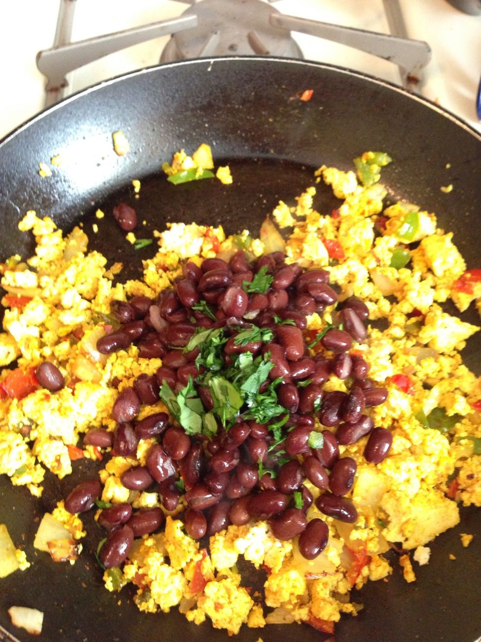 Quickly add in chopped cilantro, add salt & pepper to taste.