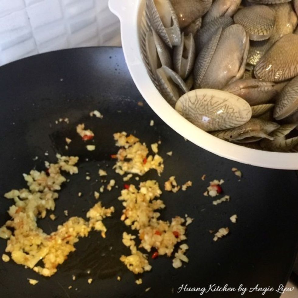 Quickly add in the cleaned and well drained clams.