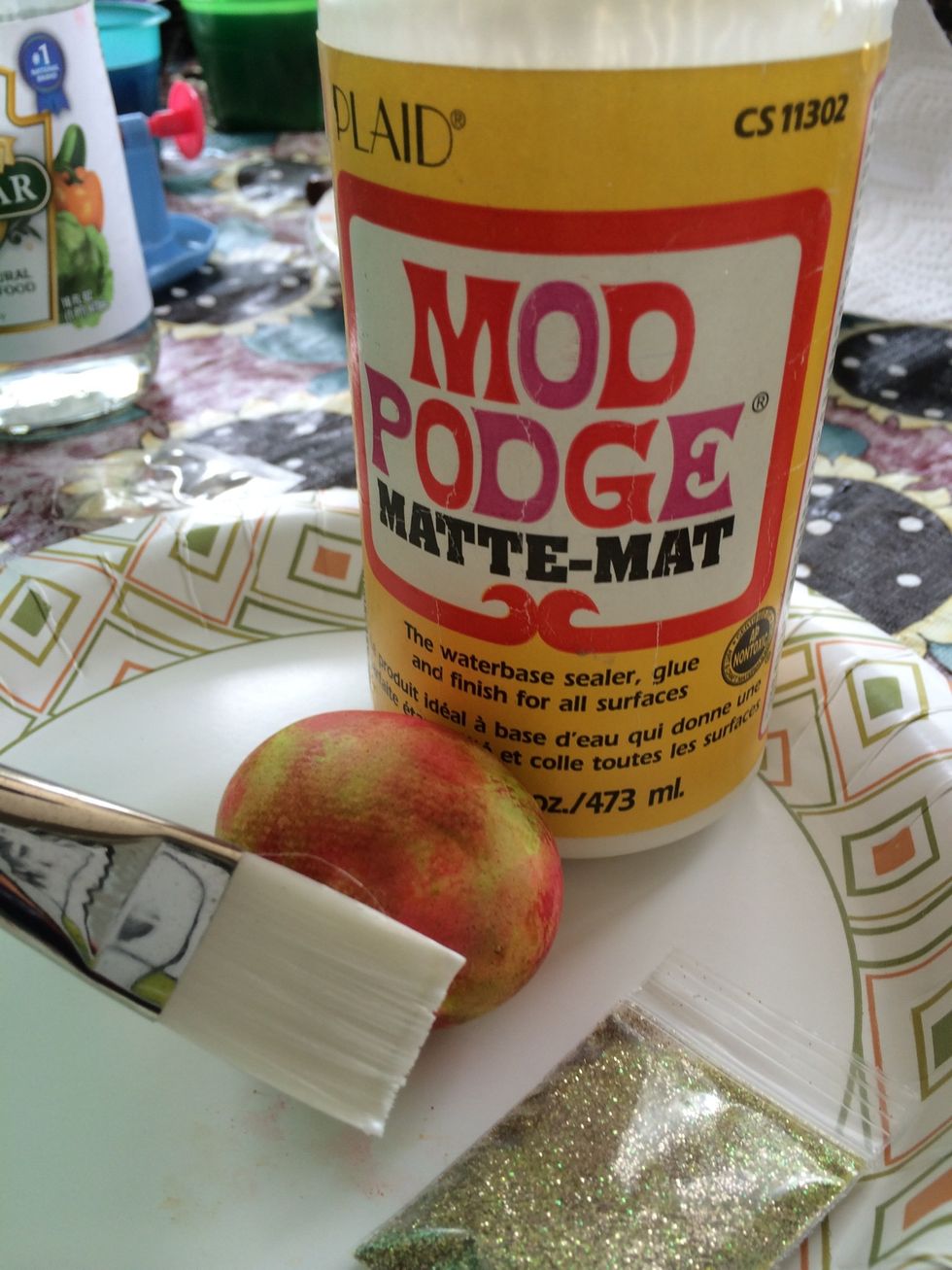 Quickly apply adhesive with the paint brush.