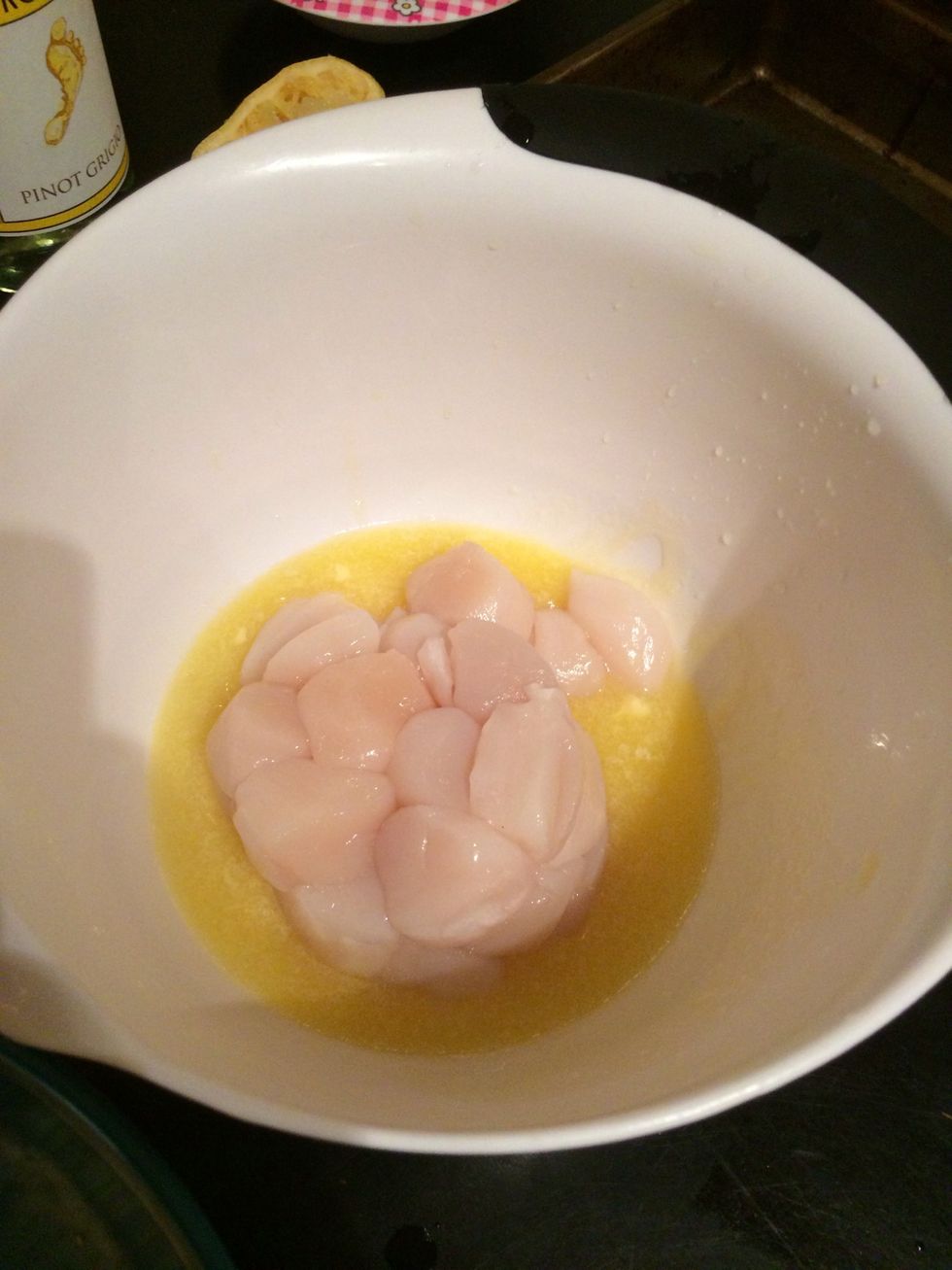 Quickly, before the butter cools, add scallops and mix so that they are evenly coated
