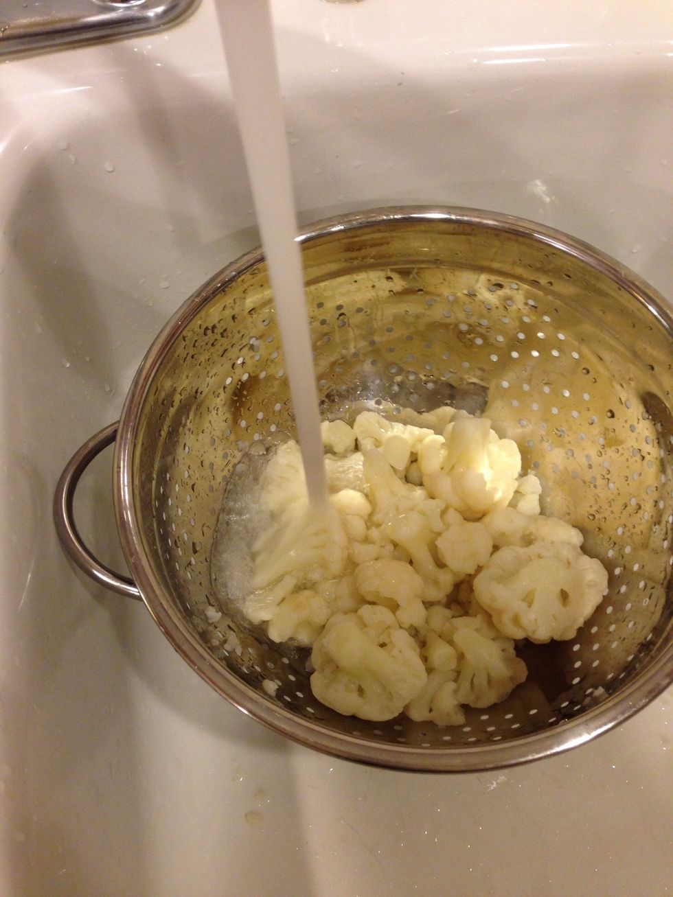 Quickly drain and rinse your cauliflower with cold water for a few seconds to cool them down a bit-- It makes them a little easier to handle