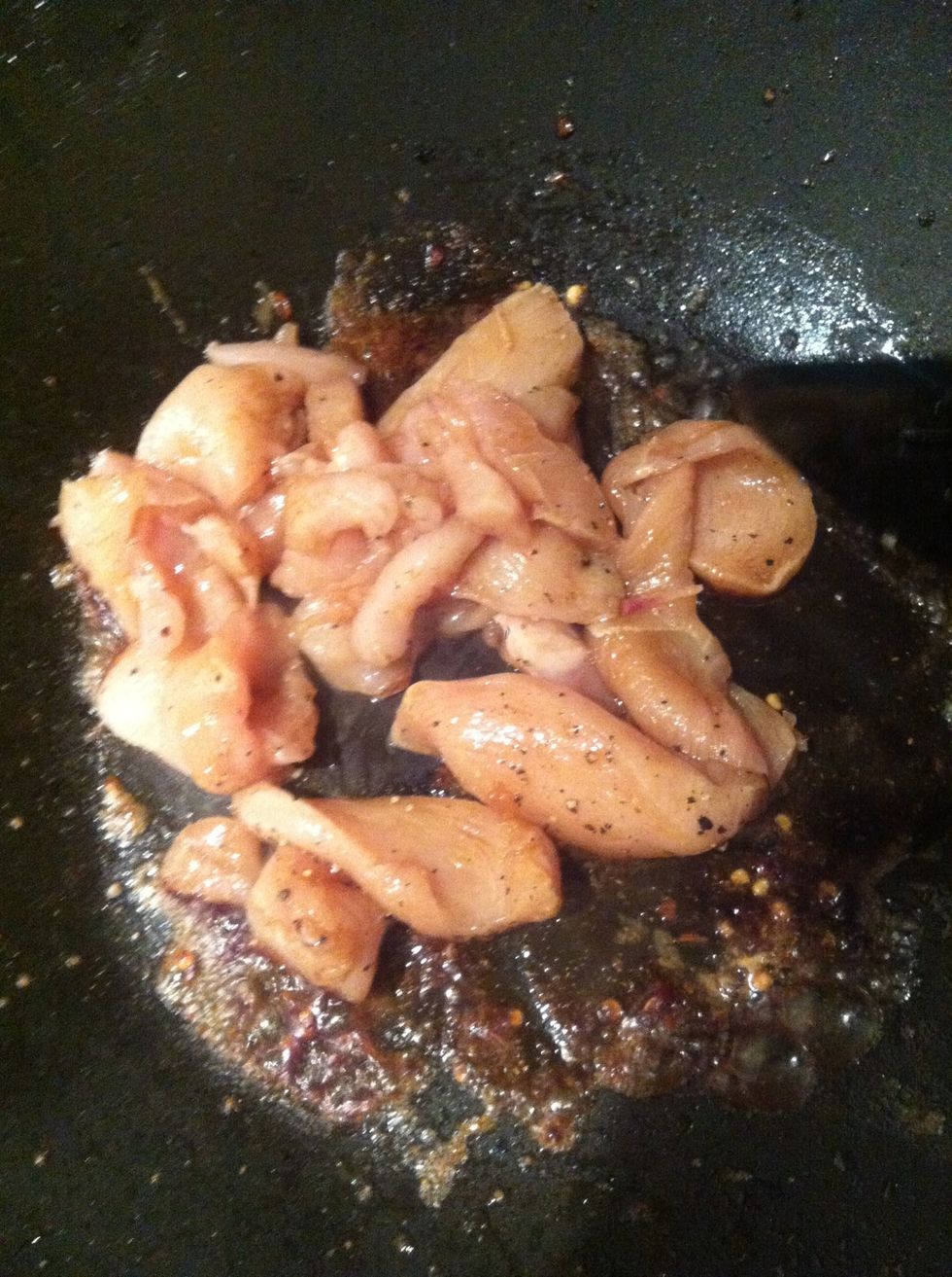 Quickly fry chicken stirring lots