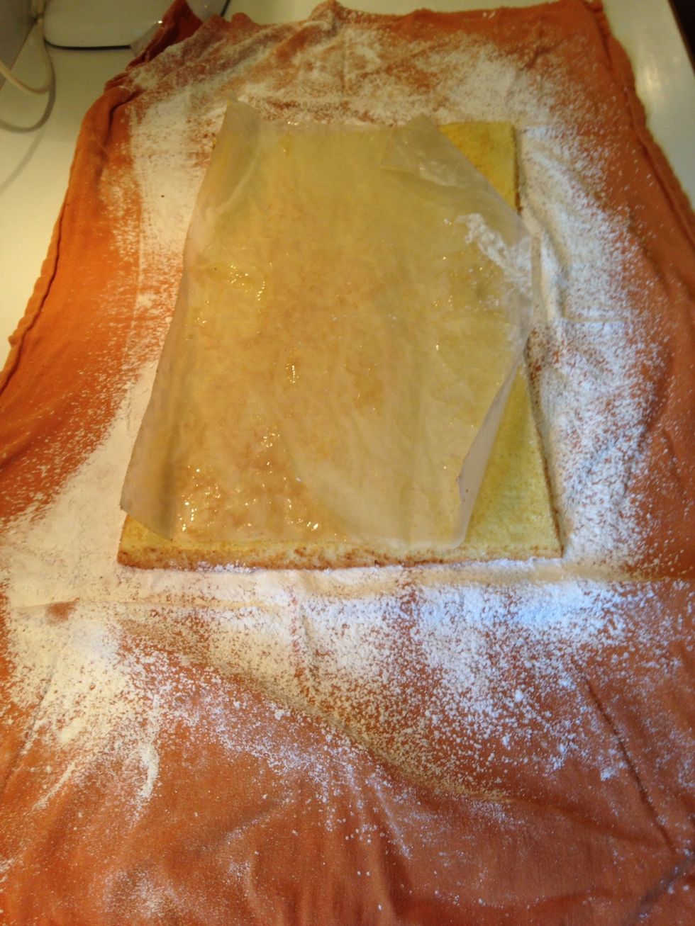 Quickly invert onto towel and remove parchment