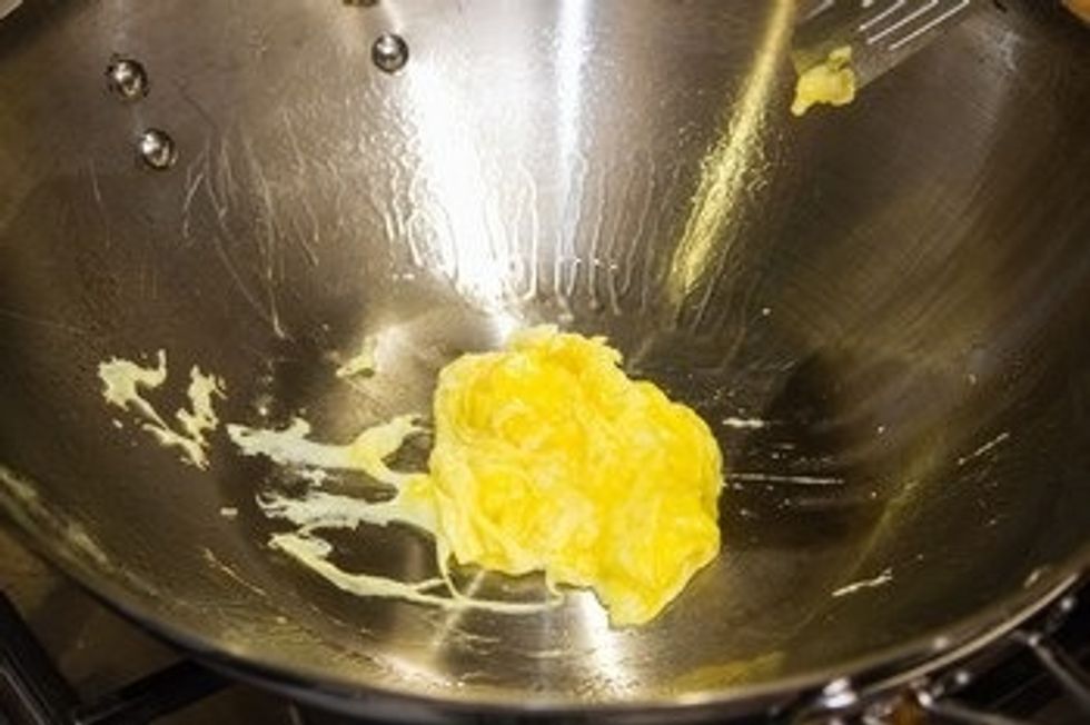 Quickly mix it with spatula and when it\u2019s 80% cooked, take it out and put on a plate.