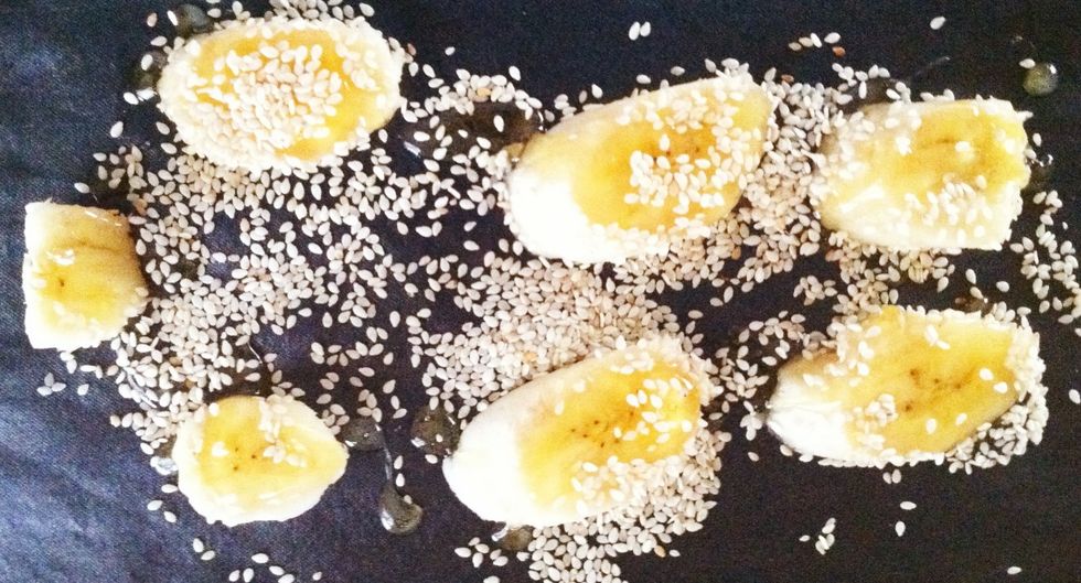 Quickly pour the caramel over the bananas and sprinkle with the sesame seeds Work fast as the caramel hardens quickly. (Silpat mat used above)