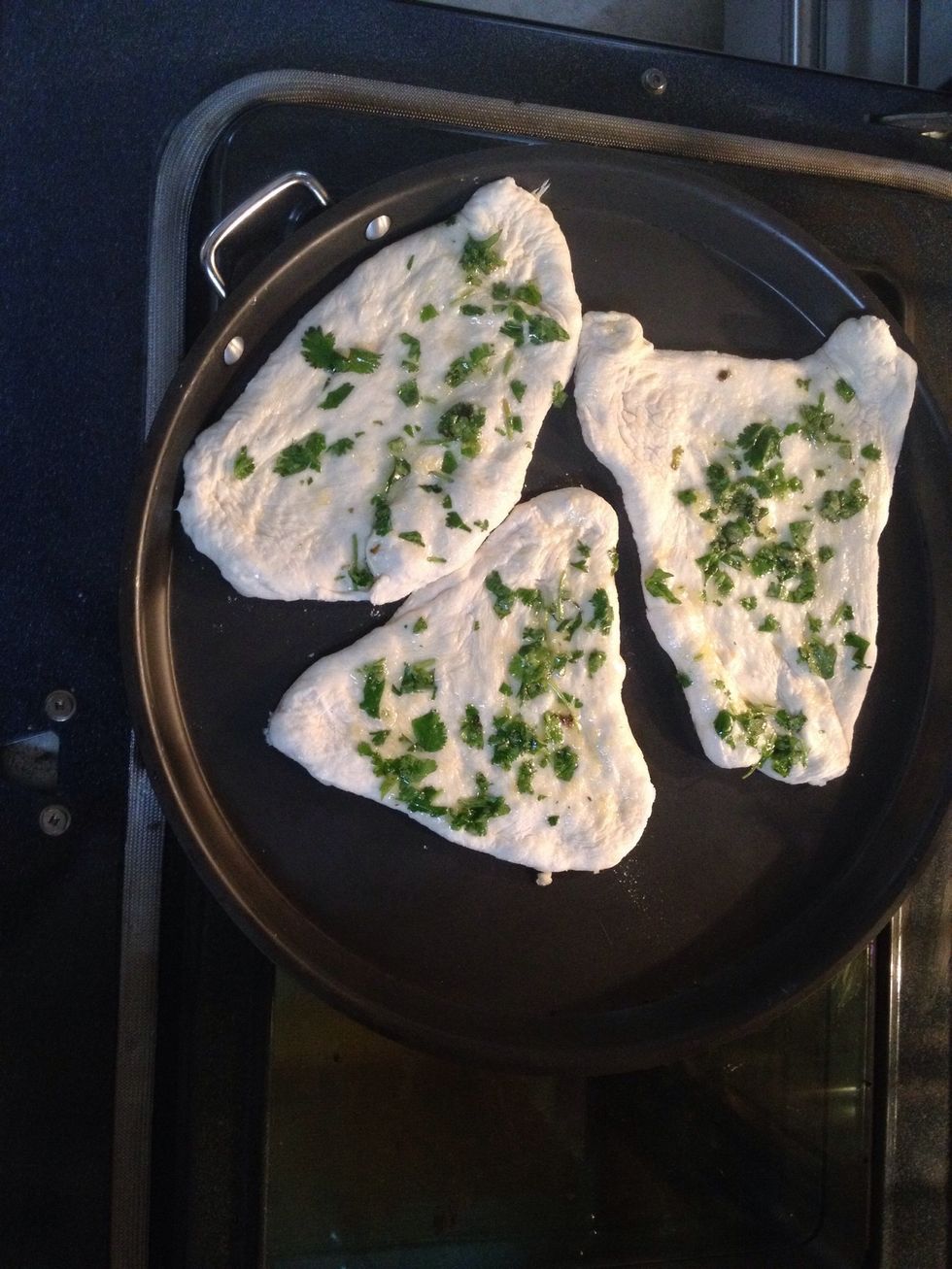 Quickly put your naan on the pizza stone you don't have to be perfect as you can see Lolz let it cook for 7-8 mins