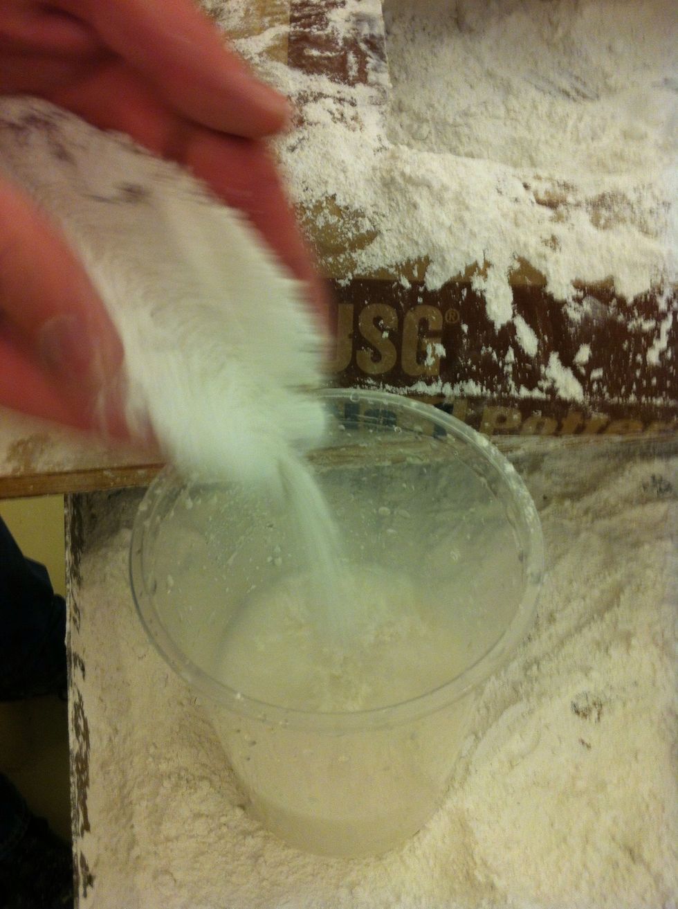 Quickly sift the plaster into the water.