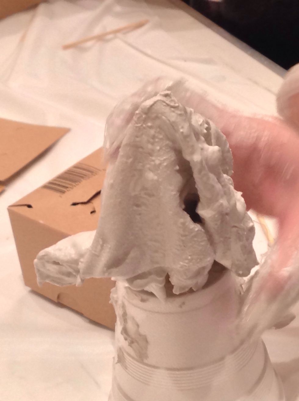 Quickly smooth the fabric into the position you want your sculpture to have.