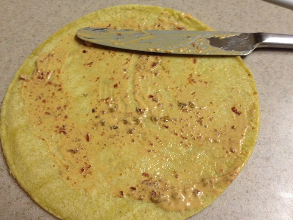 Quickly spread about 1 tbls of the chipotle mayo on the other tortilla. Then place it on top of the cheese and meat, mayo side down.