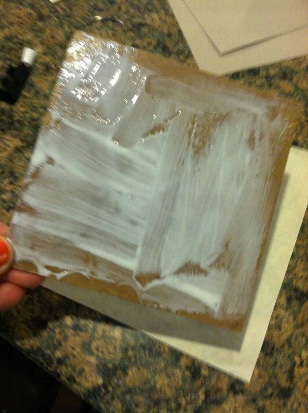 Quickly spread with a paintbrush and place onto your cover paper