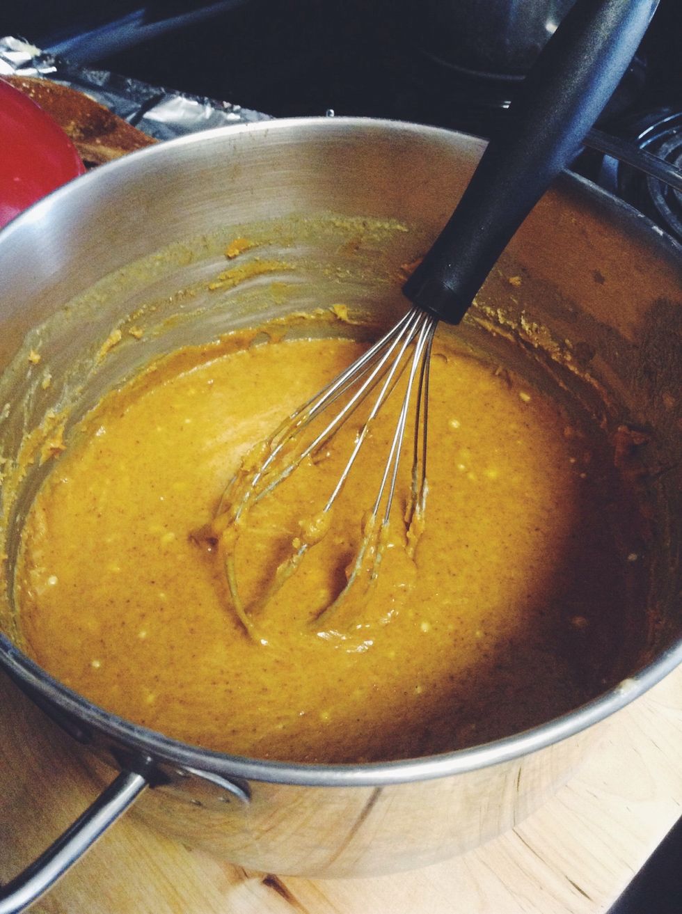 Quickly stir the mixture until it becomes nice and creamy. If it looks like this, you've done it right! It kind of looks like peanut butter or pumpkin bread batter with soft crisps of what's cooled.