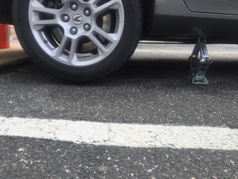 Raise the car until there is at least an inch or two between the tire and the ground. This will ensure the necessary space to safely remove the tire.