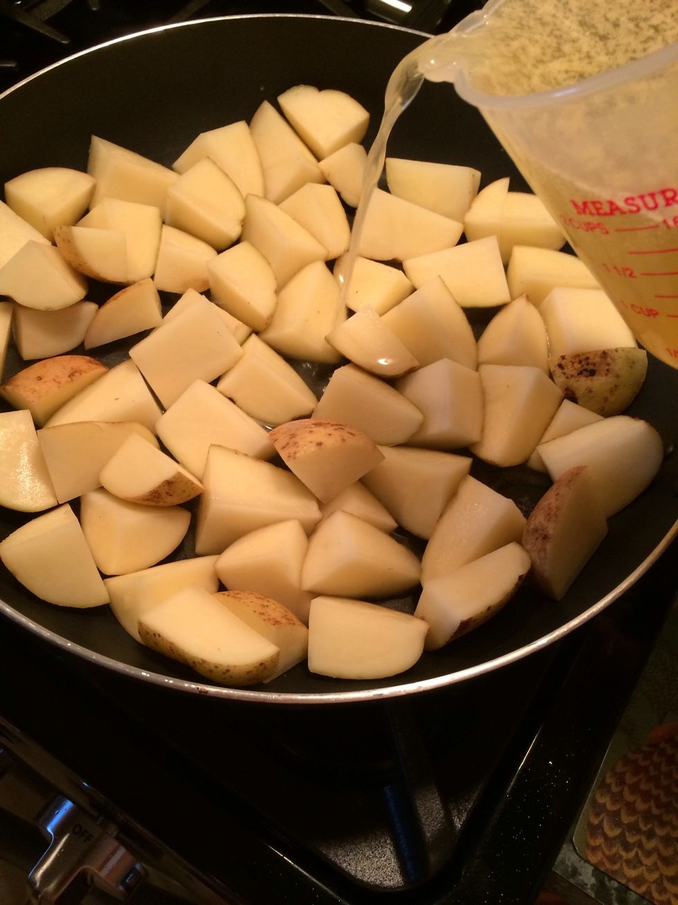 Raise the heat to medium high and pour 2 1/2 Cups of the broth in the pan. Save the other half