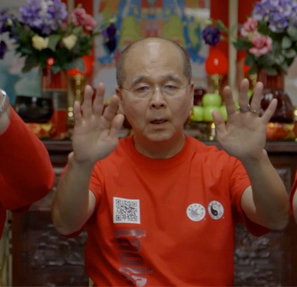 Raise your hands, palm up, above eye level, moving your torso up slightly. In a fluid motion, turn your hands palm down and slowly lower them. Repeat 10 times, or more if you see fit.