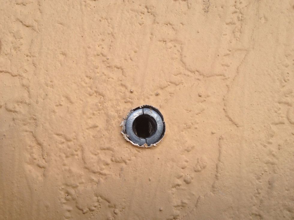 Ran the line out so it was level and marked the spot on the house. Use my masonry bit and drilled into the concrete them pushed the anchor in